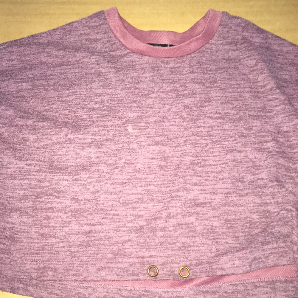A pink long sleeve crop top